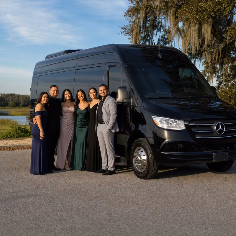 Group beside a Mercedes Sprinter limo from the Orlando fleet
