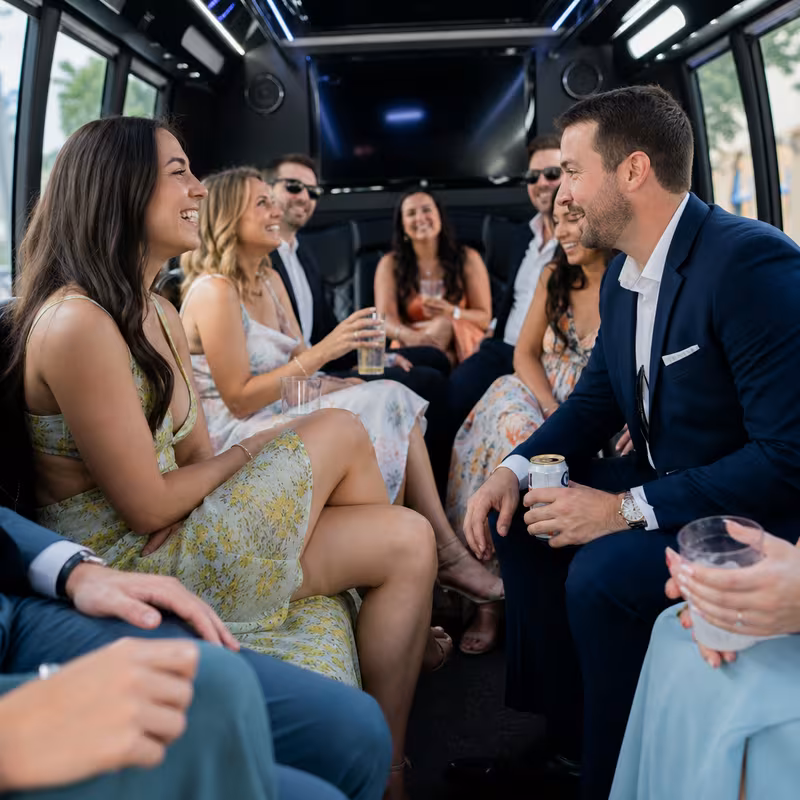 Wedding guests seated inside a Orlando party bus