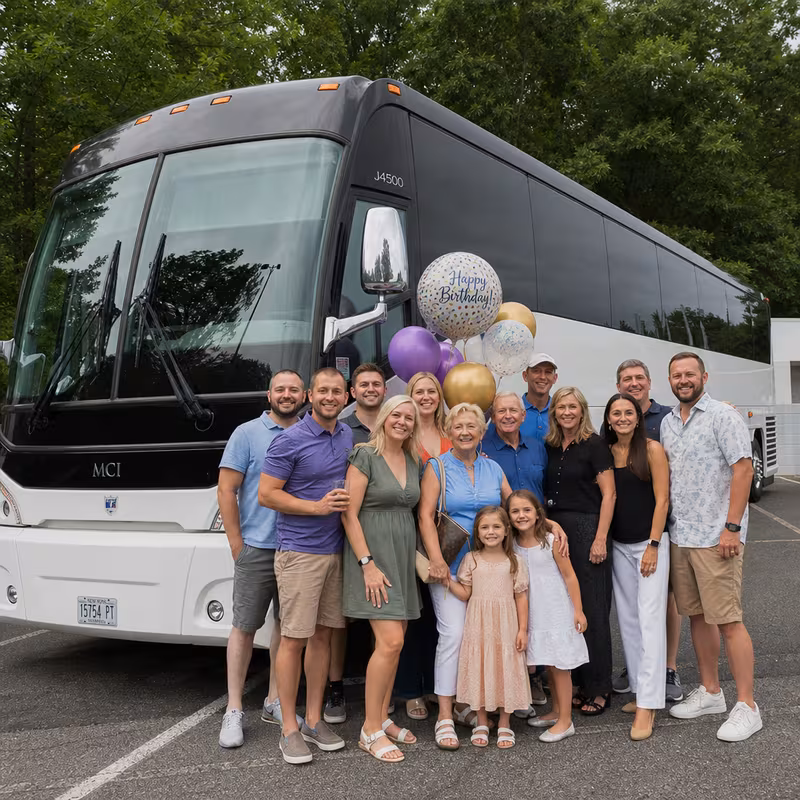 Passengers loading luggage while boarding an Orlando group shuttle