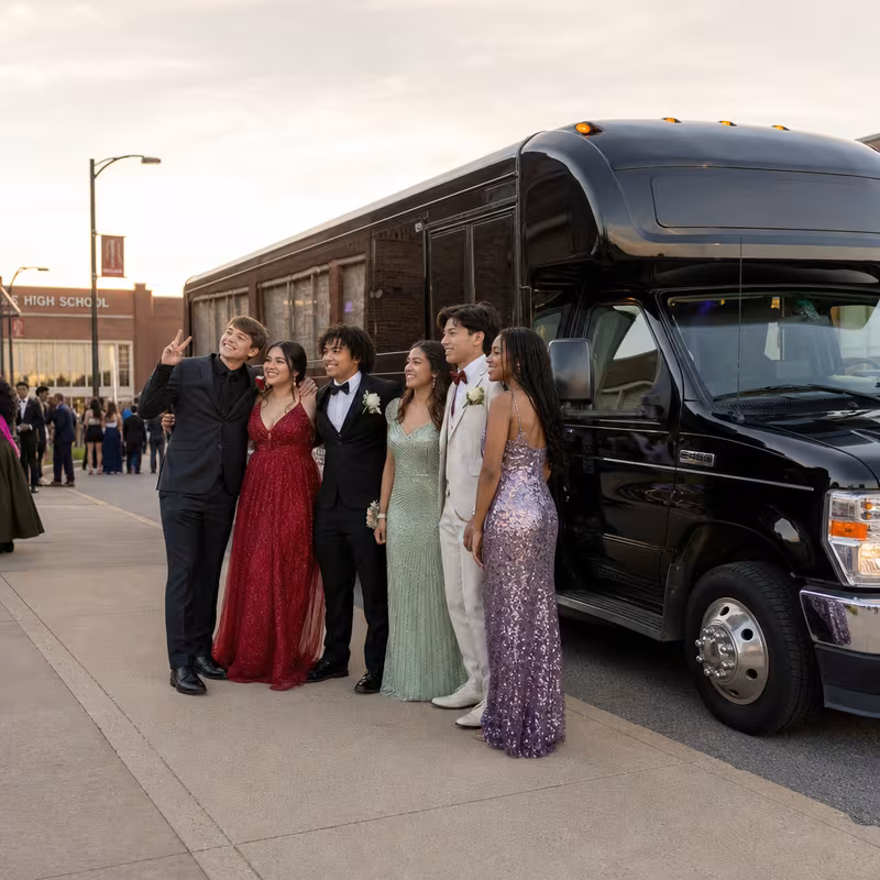 Group boarding a white charter bus for Prom & Homecoming Transportation transportation in Orlando