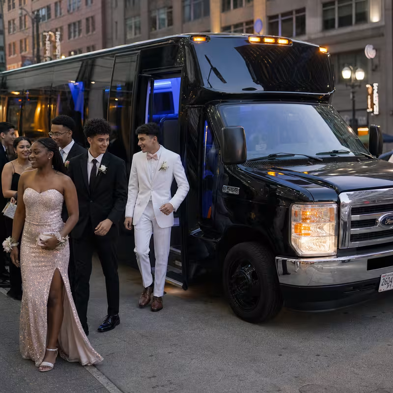 Passengers loading luggage while boarding an Orlando group shuttle