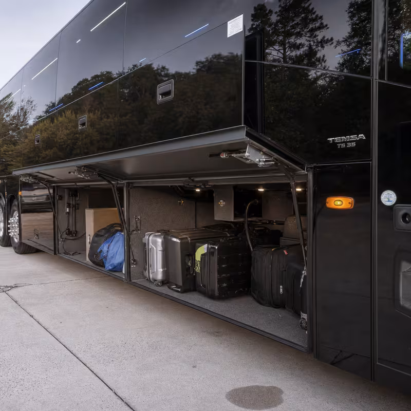 Party bus interior with wraparound leather seating and LED lighting in Orlando