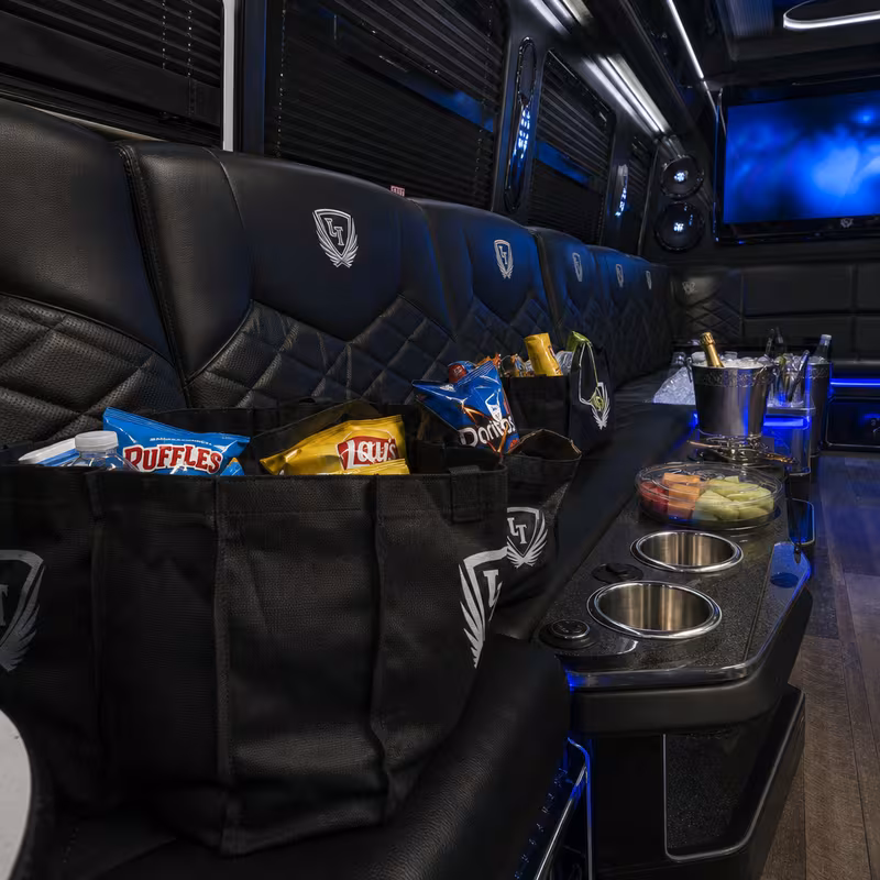 Party bus interior with wraparound leather seating and LED lighting in Orlando