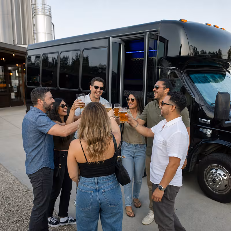 Passengers loading luggage while boarding an Orlando group shuttle